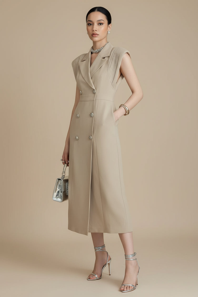 Long beige dress with off-shoulder design on a neutral background
